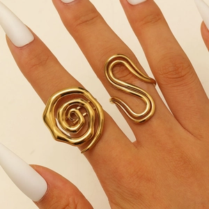 Detailed view of 18K gold plated stainless steel rings with spiral and S-shaped designs