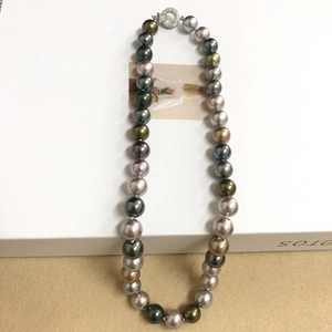 Detail of Tahitian style multi-color pearl necklace with silver crystal clasp