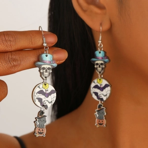 Detail showing colorful Halloween wooden drop earrings with skull and pumpkin design