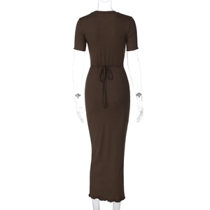 Detail view of coffee brown ribbed dress showing slim fit back and tie-waist design