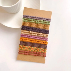Detailed set of colorful high-elastic hair ties in various woven textures on card