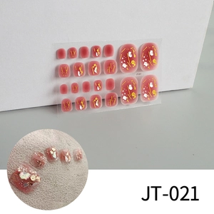 Macro detail of JT-021 toenail stickers with gold foil and white shell sequins