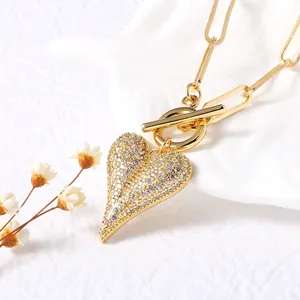 Gold heart pendant necklace with white zircons and paperclip chain with OT toggle clasp