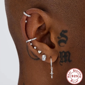 S925 sterling silver earring set with skull, dagger, and heart charms on model