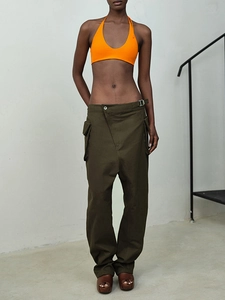 Fashion set featuring an orange halter bikini top paired with olive low-rise cargo pants