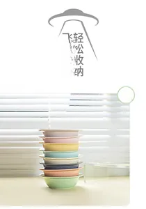 UFO-shaped ceramic pet bowls in various colors shown stacked for easy storage