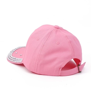 Pink baseball cap with rhinestone crown and metal buckle adjustment on white background