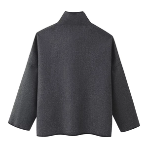 Detailed back view of dark grey oversized wool jacket with high collar and thick texture
