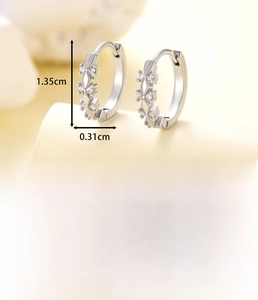 Close-up of silver copper earrings with cubic zirconia inlay and detailed dimensions