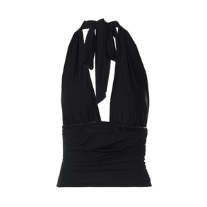 Detailed close-up of a black halter neck top with ruched waist and tie-neck details