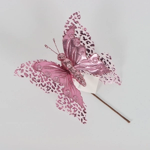 Macro detail of pink glitter butterfly decoration with mesh leopard pattern and support rod