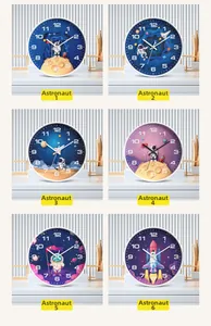 Collage of six 10-inch cartoon astronaut wall clocks with rocket and moon motifs