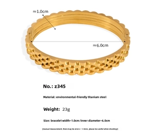 Detail of gold-plated wavy titanium steel bracelet showing 1.0cm width and 23g weight