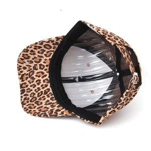 Detail view of leopard print baseball cap inner lining and metal adjustment buckle