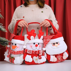 Three festive Christmas gift bags with snowman reindeer and Santa Claus 3D designs
