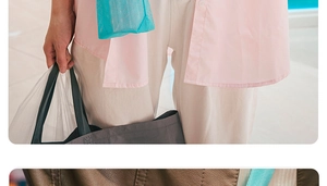 Close-up of a blue mesh water bottle carrier bag with a portable shoulder strap for kids