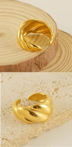 Detailed view of adjustable 18k gold plated croissant ring with twisted texture