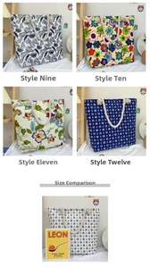 Multiple printed canvas tote bags with rope handles showing size contrast with books