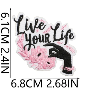 Detailed size view of Live YOUR Life embroidered patch with flower and hand design
