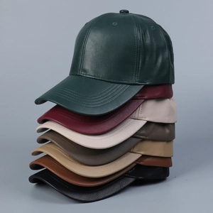 Detailed view of stackable faux leather baseball caps in seven assorted matte colors