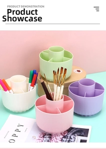 Overhead view of rotating desk organizer in four pastel colors for stationery and makeup brushes