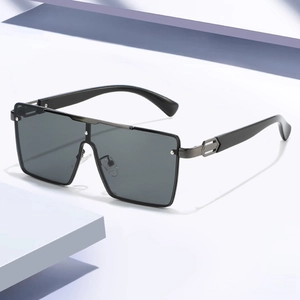 Fashionable oversized square sunglasses with black lenses and metal decorative temples