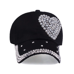 Black baseball cap with pearl heart and rhinestone details for a stylish fashion look