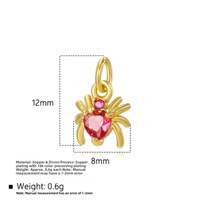 Detail of 12x8mm spider charm with pink heart zircon and 18k gold plated copper finish