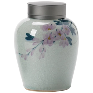 Hand-painted ice-cracked celadon tea canister with pink flowers and a metal lid