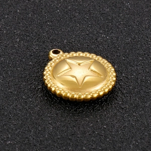 Golden round celestial charm featuring a 3D star relief and beaded edge detail