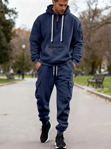 Navy blue men's tracksuit set with hoodie and joggers featuring soft fleece texture detail