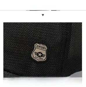 Close-up of black breathable mesh baseball cap with embroidered sport shield badge