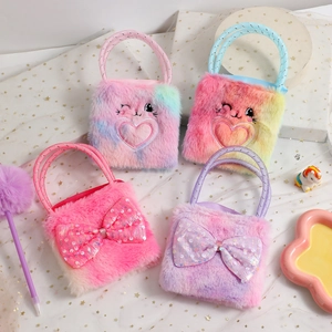 Detail of plush children's handbags with sequin bows and heart embroidery