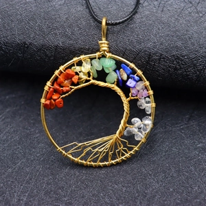 Handmade golden Tree of Life necklace with colorful natural chakra stones on black leather