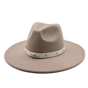 Detail of broad-brimmed fedora with white leather band and golden metallic rivets