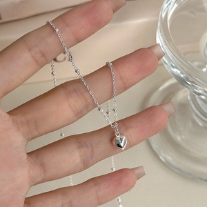 Minimalist S925 sterling silver heart pendant necklace with elegant beaded chain detail