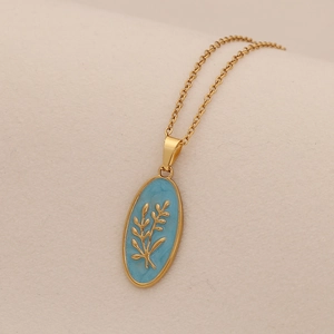 Golden oval pendant necklace with blue enamel and fine plant engraving for women