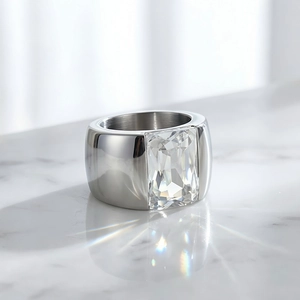 Detailed macro view of a silver titanium steel ring with a large rectangular clear gemstone