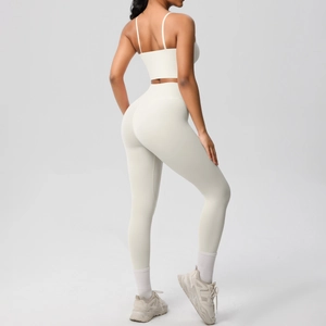 Detail view of cream white two-piece yoga set showing back strap design and high waist fit