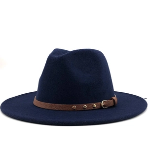 Detailed close-up of navy wool fedora with brown leather belt and gold studs decoration