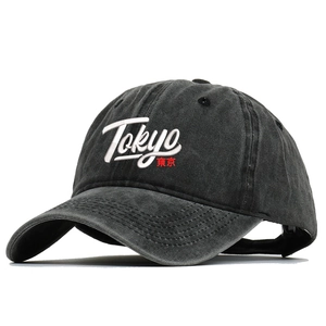 Washed black baseball cap with white Tokyo embroidery and red Japanese text