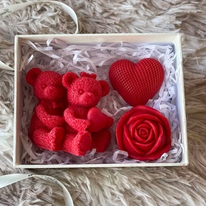 Red rose bear and heart aromatherapy candle gift set on plush background