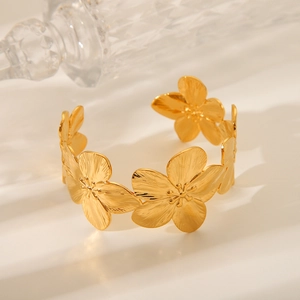 Elegant gold flower titanium steel open cuff bracelet with detailed floral texture