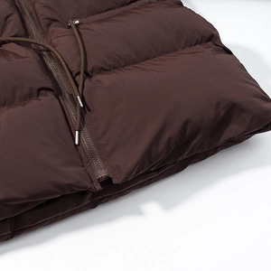 Detailed view of the brown windproof coat showing zipper and adjustable drawstring hem