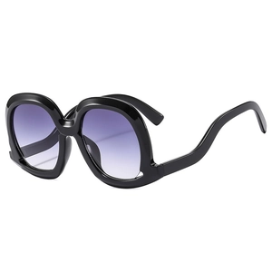 Fashionable oversized wavy black sunglasses with purple gradient lenses for women