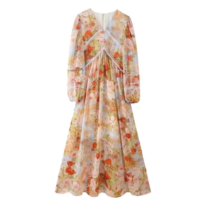 Floral V-neck dress with long lantern sleeves and lace panels in orange pink