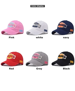 Close-up of vintage cotton baseball caps with 1968 embroidery in six assorted colors