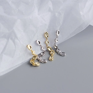 Detailed view of gold and silver S925 sterling silver irregular tassel stud earrings