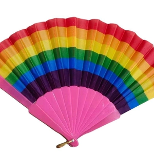 Rainbow folding fan with pink plastic frame and gold ring against a white background
