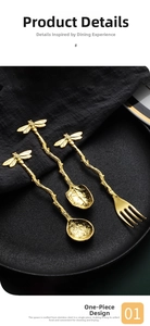 Close-up of golden stainless steel spoons with branch handles and bee motifs on black tray